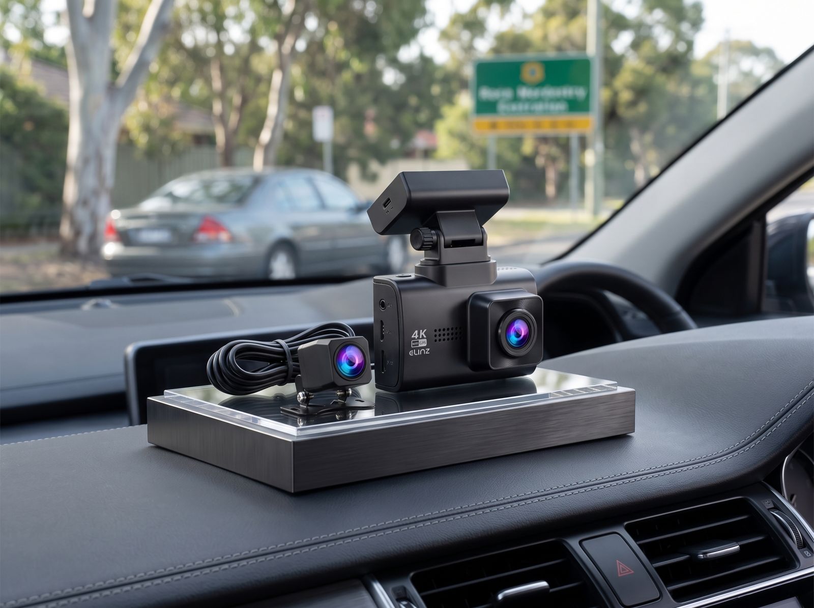 4K dash cam with GPS module and rear camera kit displayed inside a vehicle, ready for installation.
