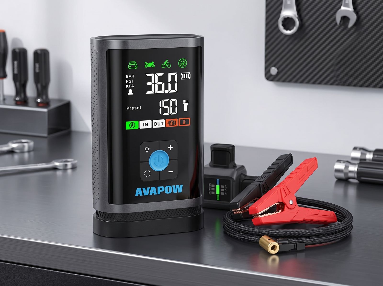 AVAPOW portable jump starter with built-in digital tyre inflator, LCD display, air hose, and jumper clamps on a workshop bench.