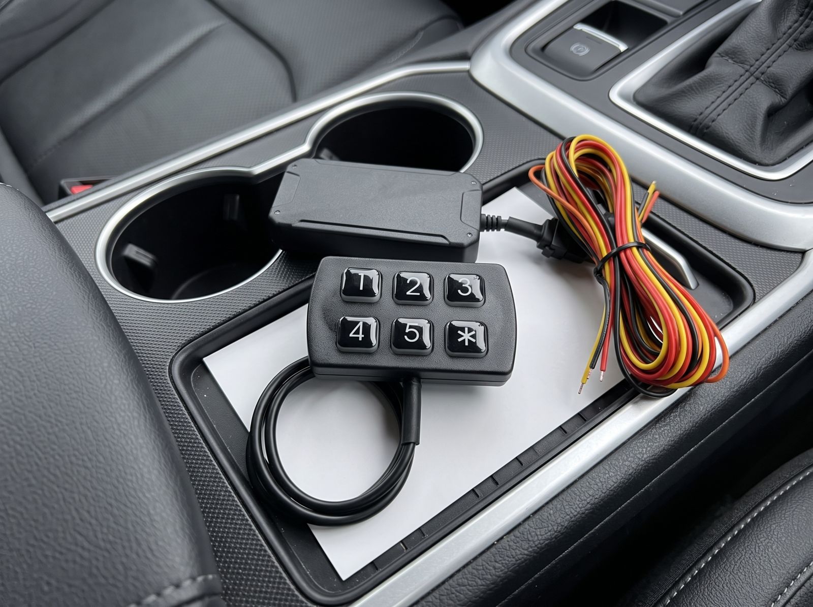 Engine keypad immobiliser kit including PIN keypad, control module and wiring harness ready for vehicle installation.