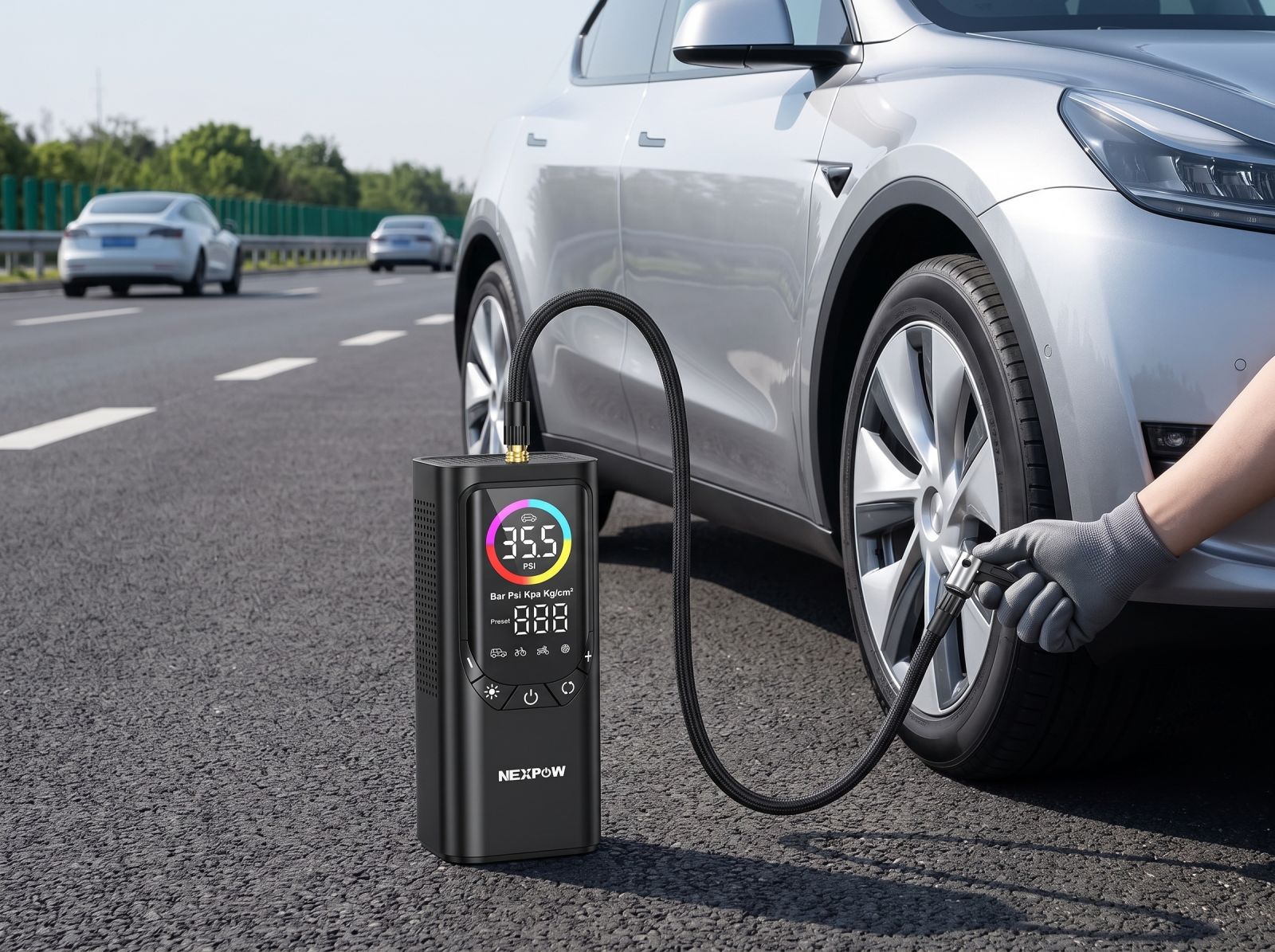 Portable digital tyre inflator connected to a car tyre for roadside tyre inflation.
